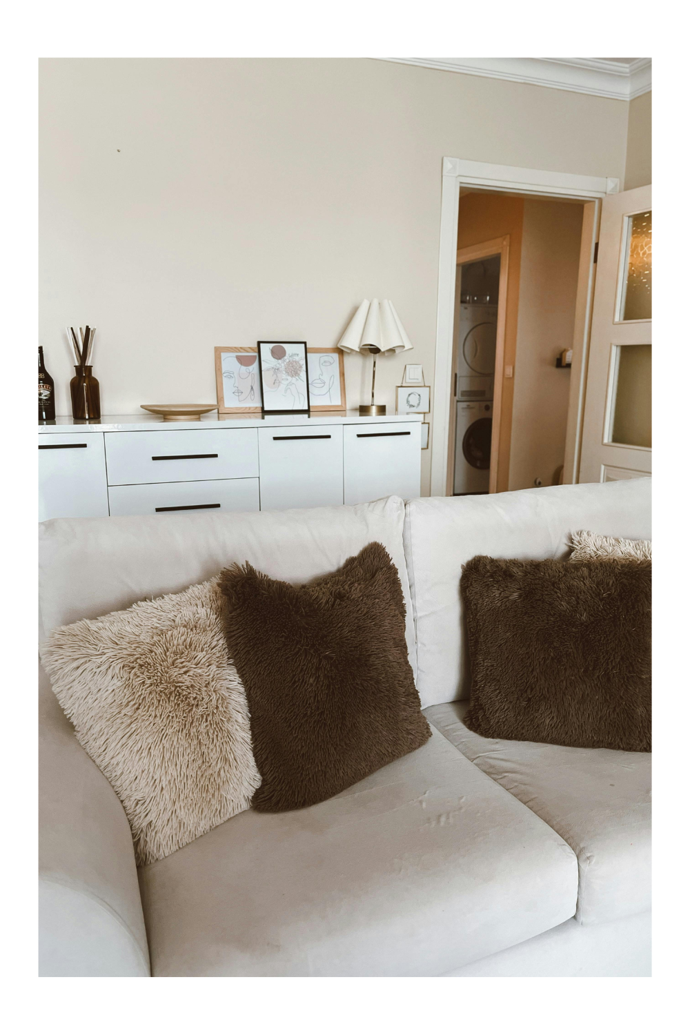 Cozy neutral living room with warm wood accents and natural light
